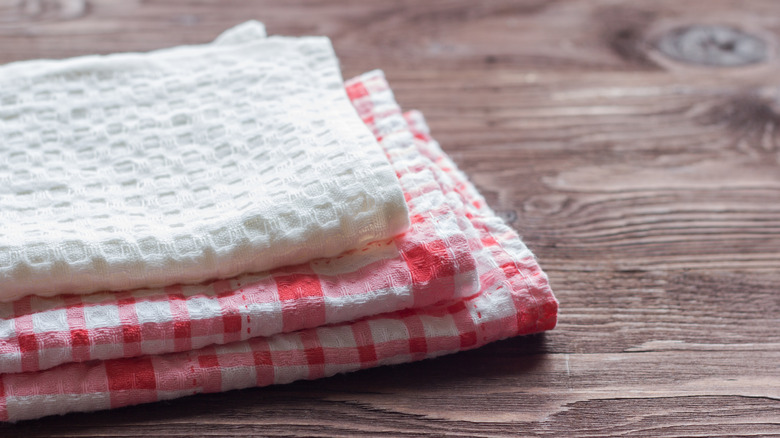 Kitchen towels on wood surface