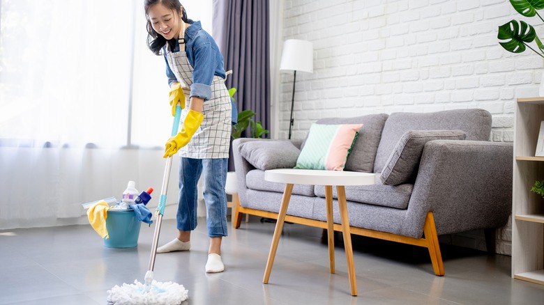 woman mopping floor