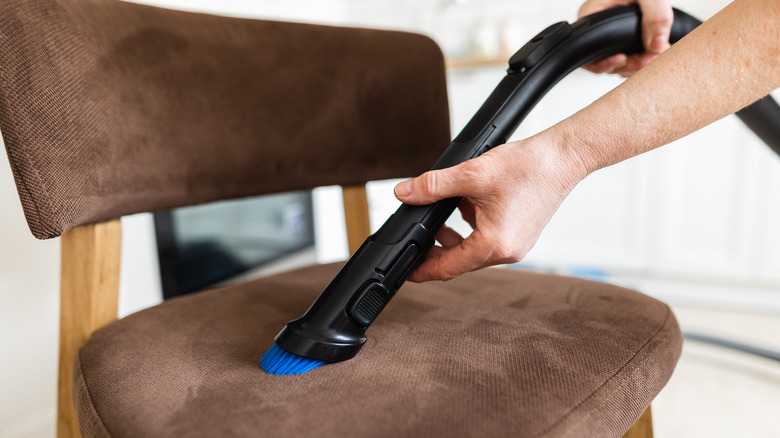 vacuum brush on chair