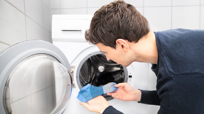 Man perplexed by missing sock