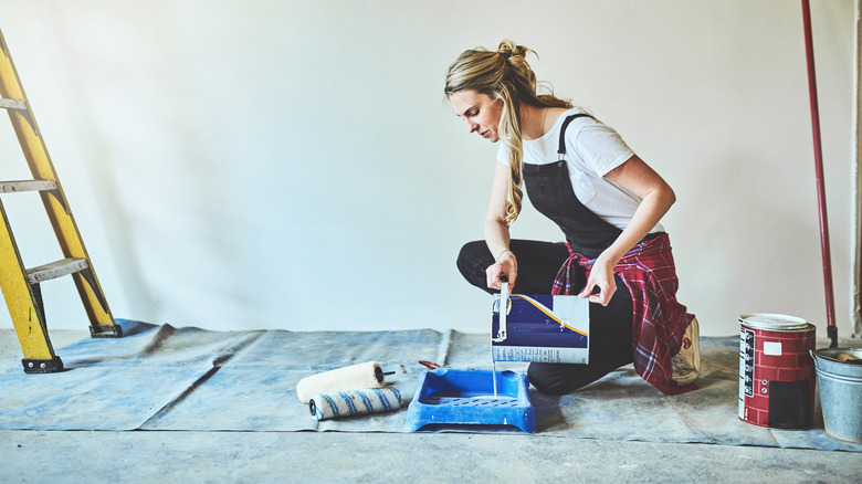 woman painting a room
