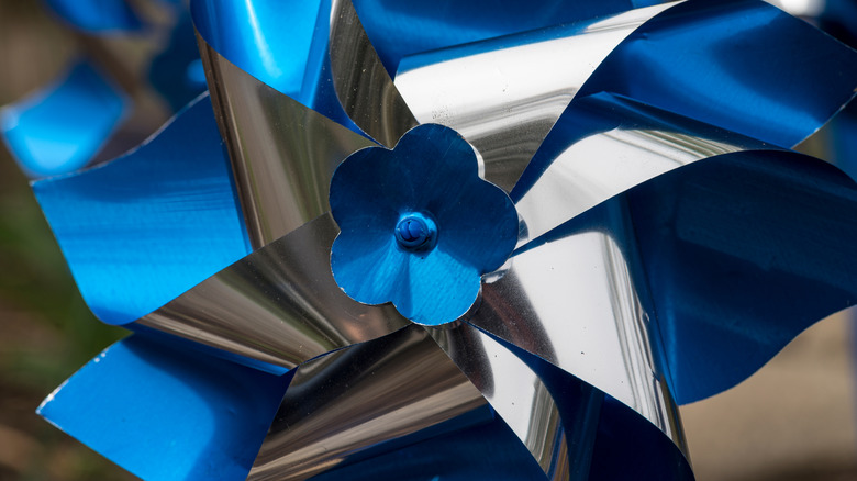 Close up of a blue and silver pinwheel