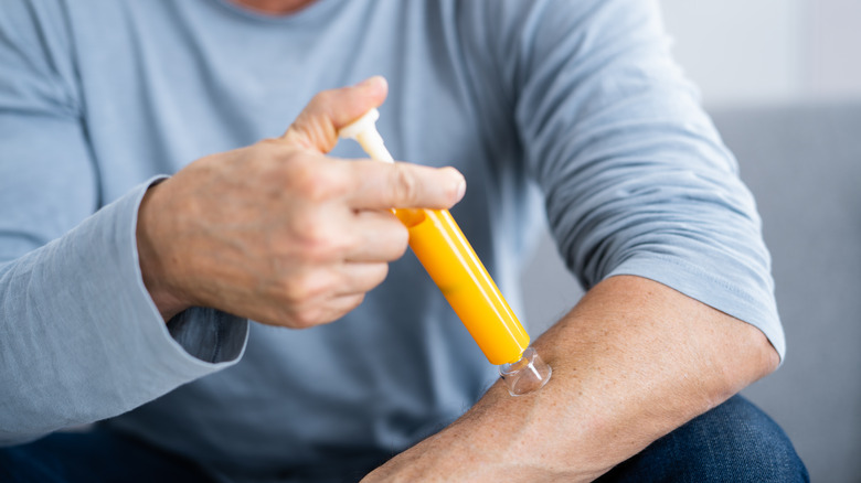 Person using suction tool on bite
