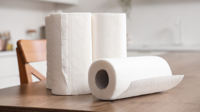 Three paper towel rolls on a counter