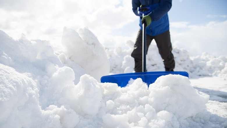 person shoveling snow