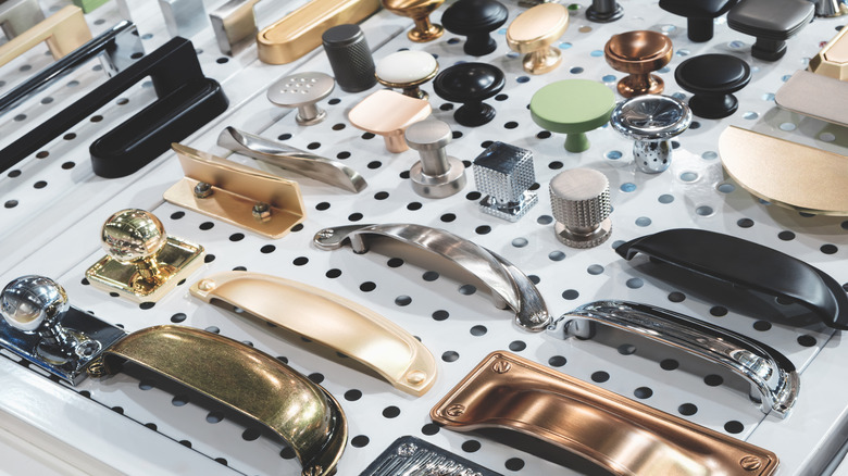A collection of knobs and pulls on display in a store
