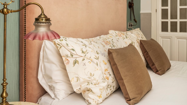 pink velvet headboard in bedroom