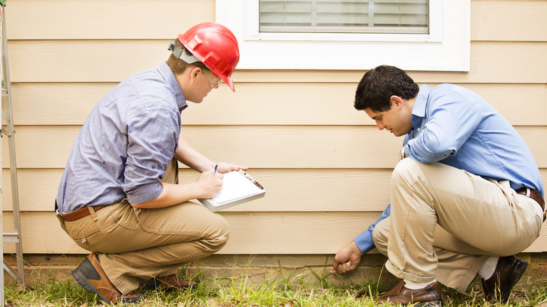 engineers examine home foundation