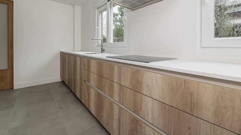 Kitchen with white synthetic stone countertops