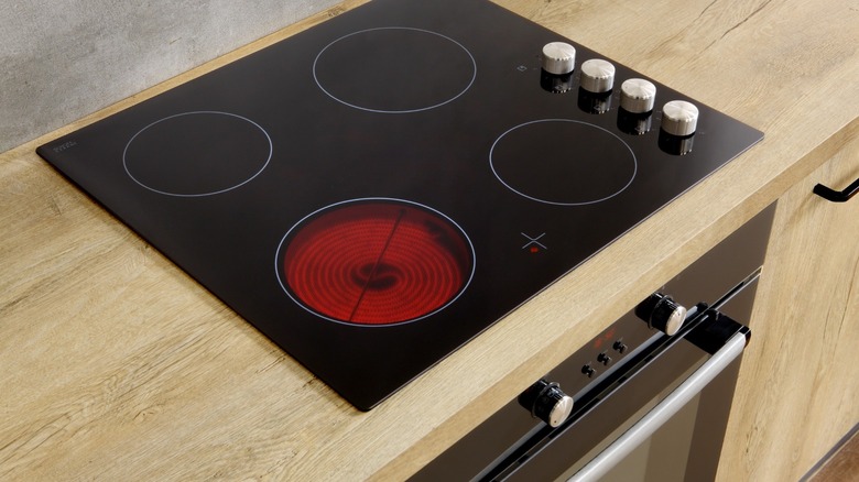 Electric stove with burner on