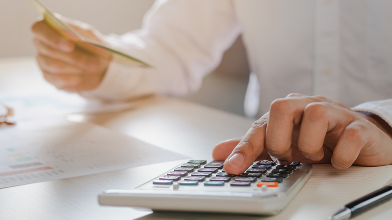 Person calculates budget