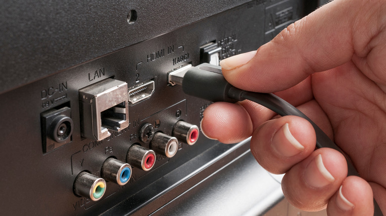Plugging cables into TV