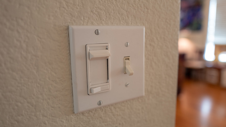 dimmer light switch on a wall