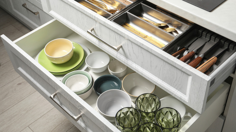 Open drawers with everyday use kitchen items
