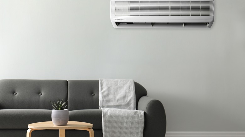 air conditioner over gray couch