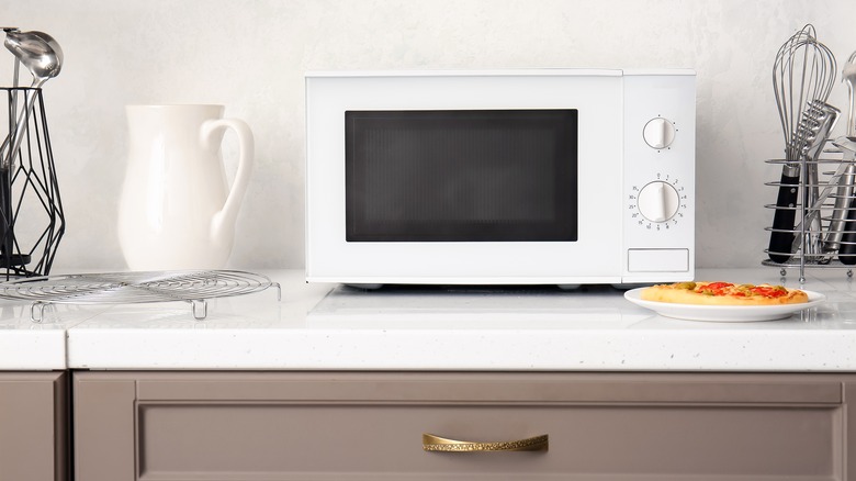 white microwave on counter top