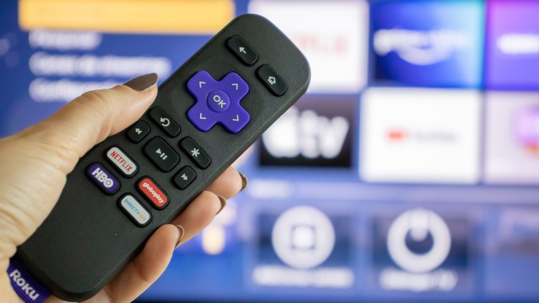 Roku remote in front of screen