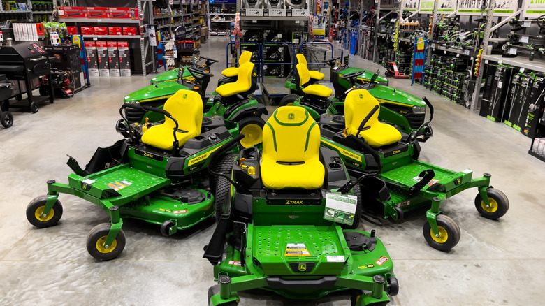 John Deere zero-turn mowers on a retail shop sales floor