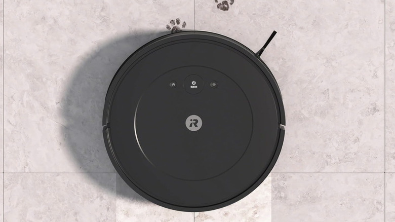 roomba mop and vacuum combo cleaning paw prints and dirt off of tile floor