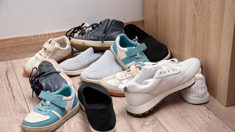 A scattered pile of shoes on the floor