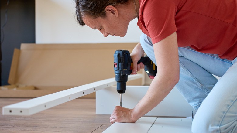 Someone using a cordless drill for DIY