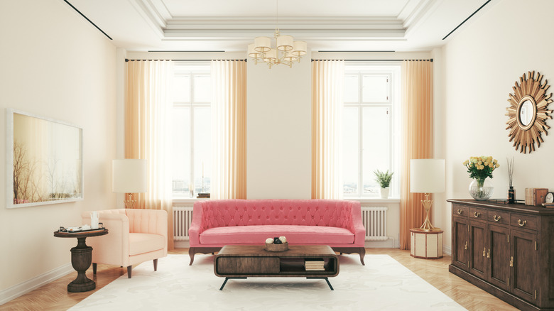 Vintage pink couch near window