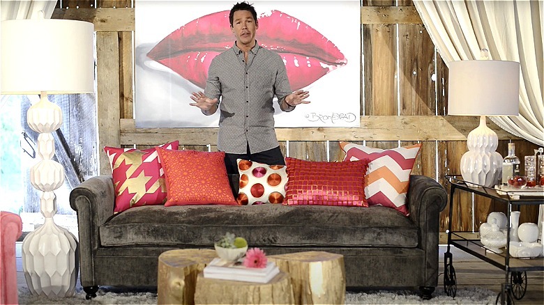 David Bromstad standing in a colorful room.