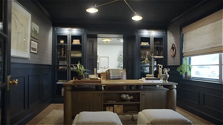 A moody, dark blue contemporary office space.