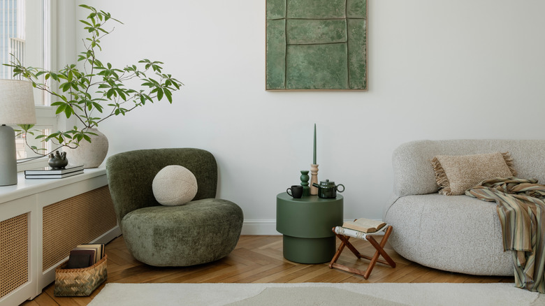 A modern living room with pops of green.