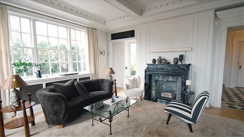 An elegant living room with modern and vintage furniture.