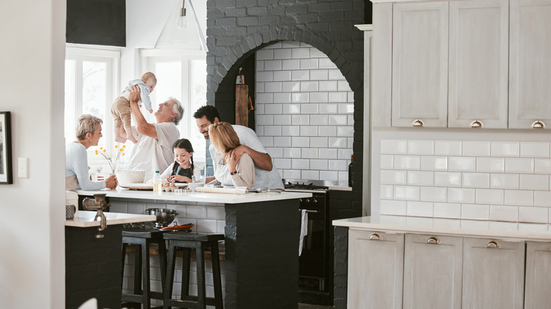 A large open kitchen with multigenerational family