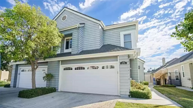 Bue siding and white garage 