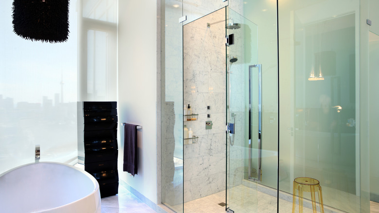 view of clean bathroom with glass shower doors
