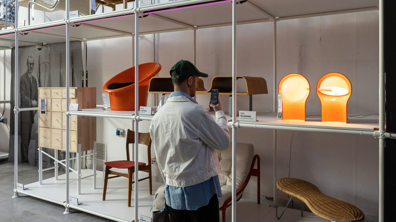 Person shopping for chairs in an IKEA store.