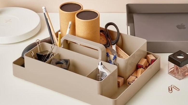 IKEA KUGGIS desk organizer in two parts, housing stationery and a laptop
