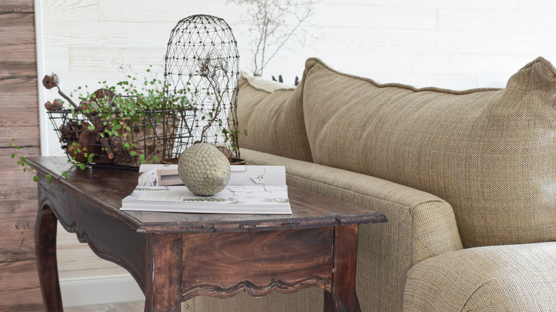 console table behind couch