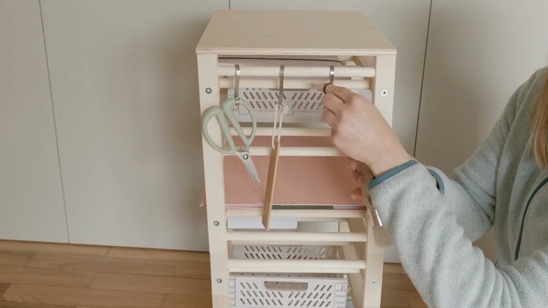 Close up of IKEA HUTTEN wine rack used as office organizer