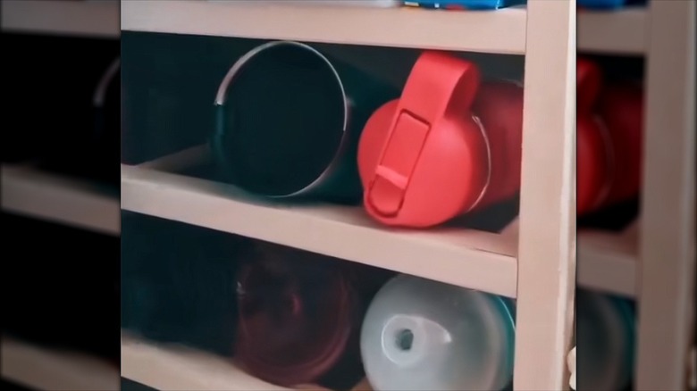 Close up of water bottles stored on IKEA HUTTEN wine rack