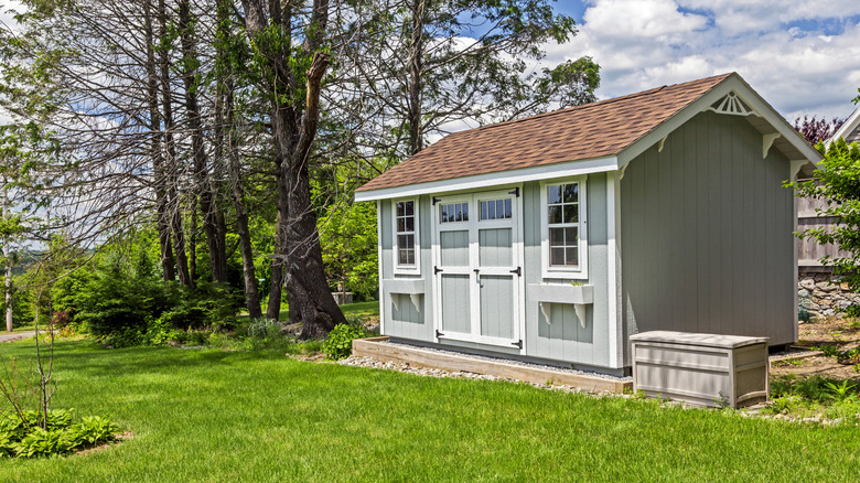 An attractive wooden shed in a yard