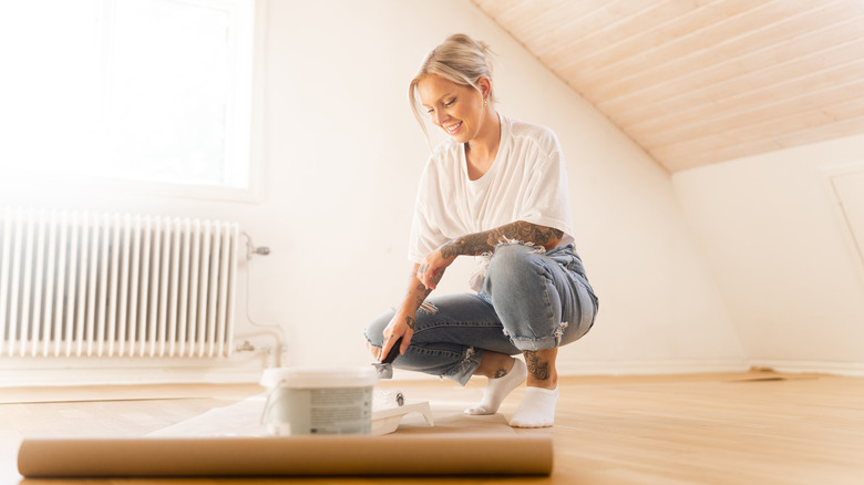 Woman painting her home