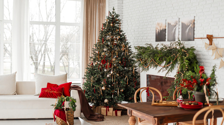 Dining table with beautiful setting in living room decorated for Christmas celebration