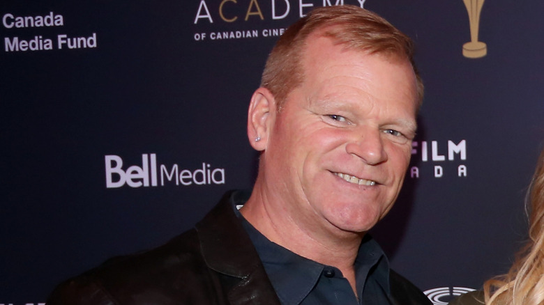 Mike Holmes smiles at an event