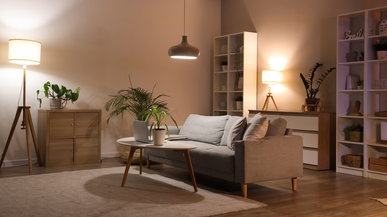 A living room with low lighting and no windows.