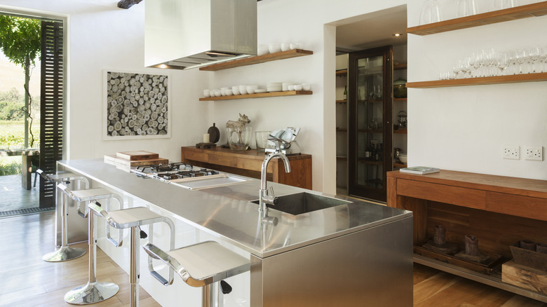 A modern kitchen with a stainless steel countertop