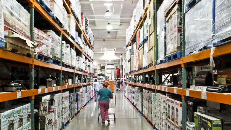 Woman shopping in Costco aisle