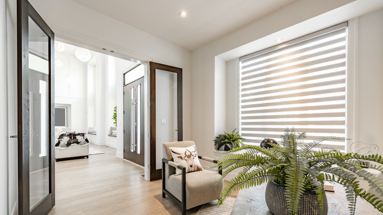 Glass doors open between rooms