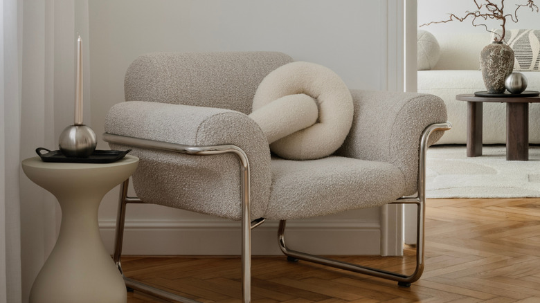 Close up of a boucle fabric arm chair.