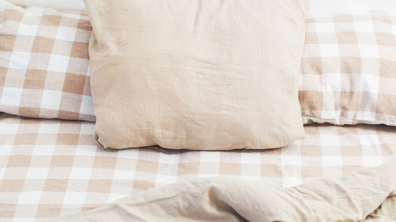 Beige checkered bedding set.