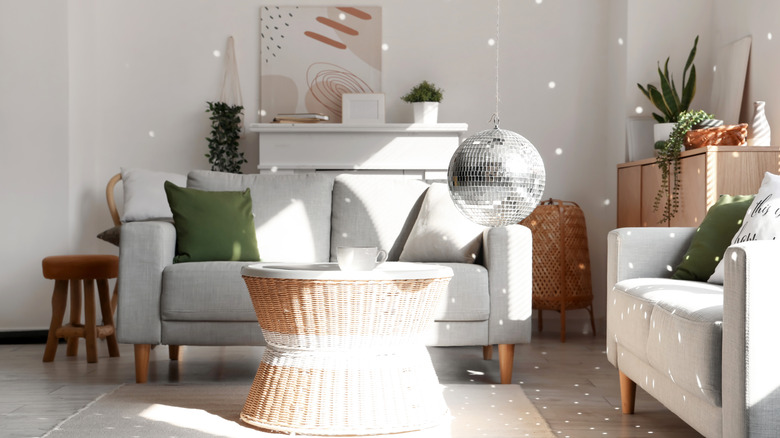 A modern living room with a disco ball.