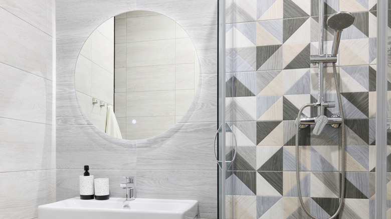 Bathroom interior showing various irregular tile applications.
